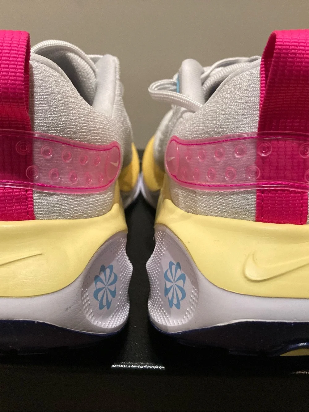 Nike White Athletic Shoes with Blue Swoosh and Yellow Midsole